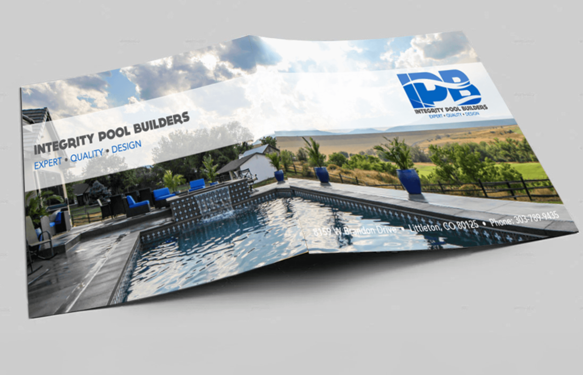 Brochure showing a swimming pool, outdoor seating, and a landscape with trees and sky.